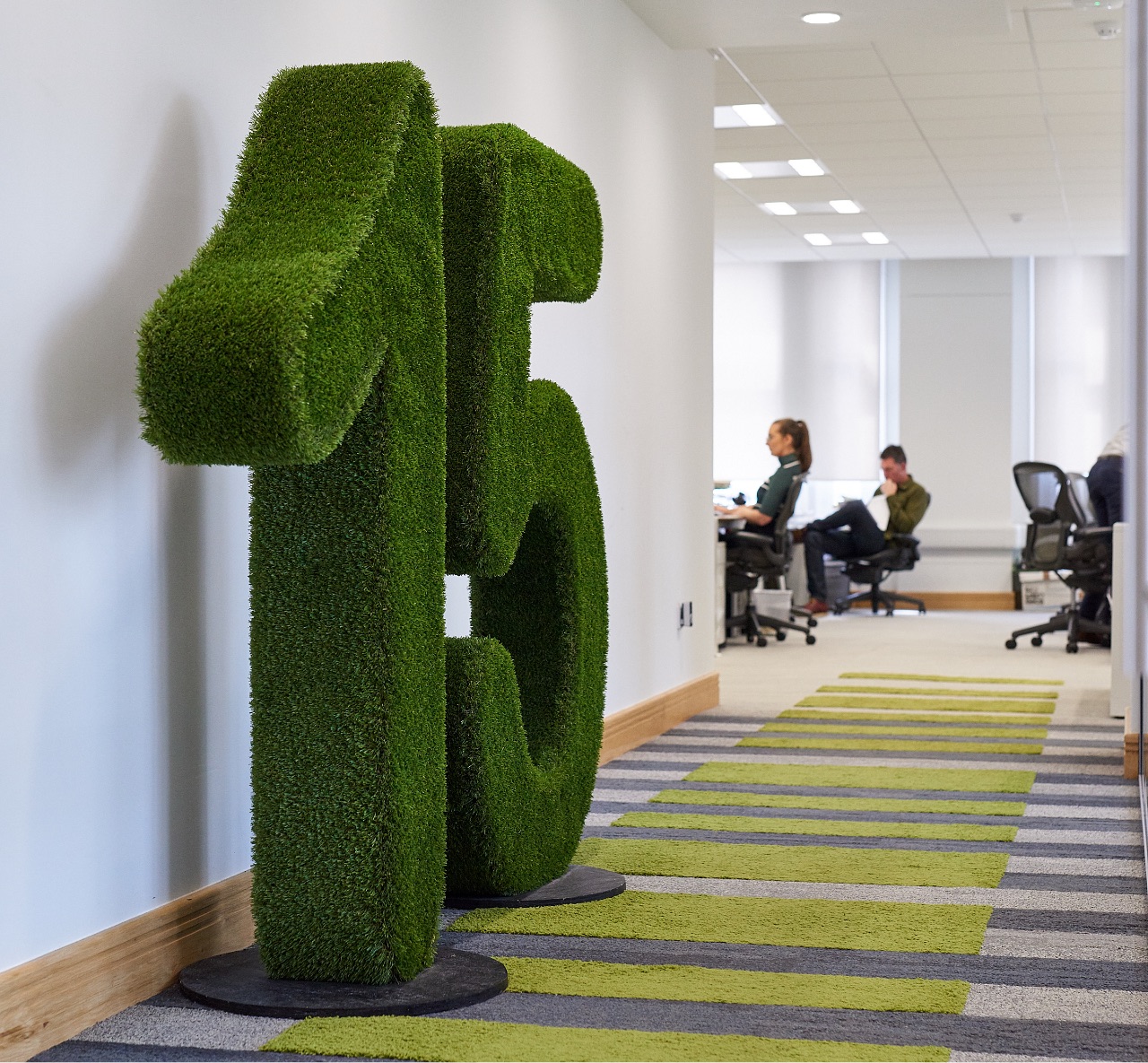 A large, decorative number '15', representing 15 years of Richborough, in an office hallway.