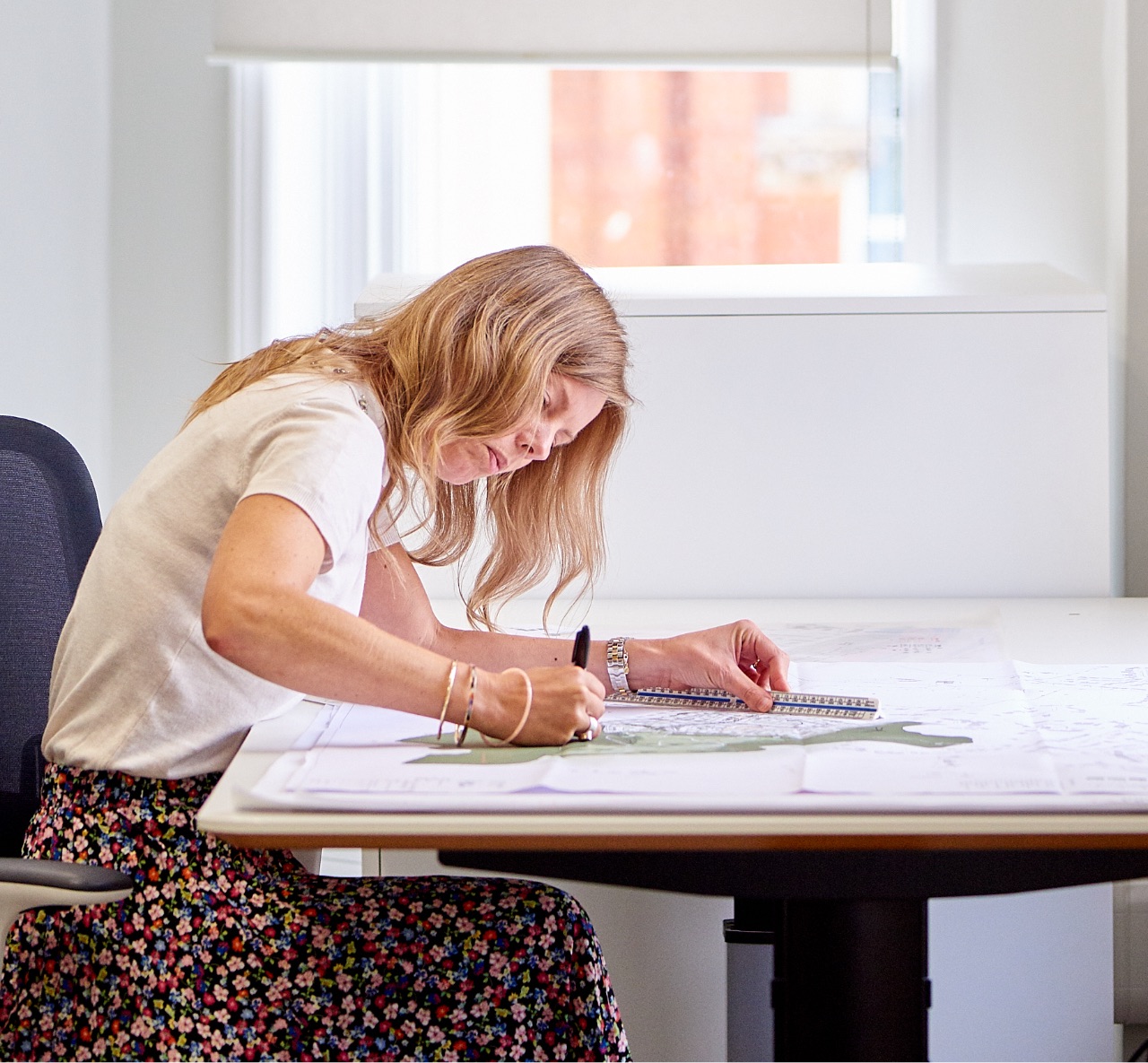 A team member working on a site plan.
