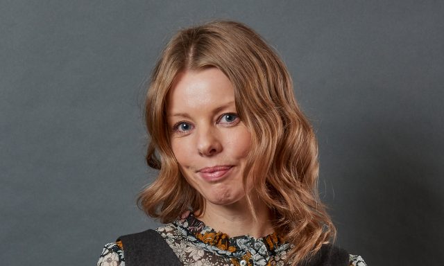 Charlotte Lewis of Richborough Estates smiling infront of grey screen