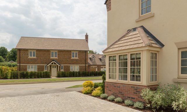 Side profile view of beige coloured houses in new development