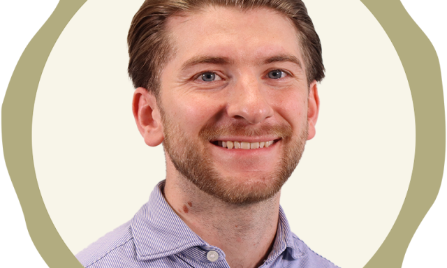 Picture shows Owen Weaver in an open necked short, smiling at the camera. It is a corporate image, used within a Richborough graphic.