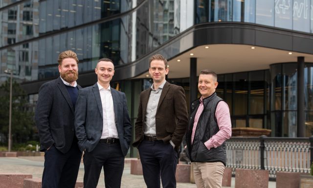 Smiling men from Richborough at their new Manchester office