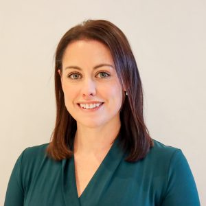 smiling woman in green dress